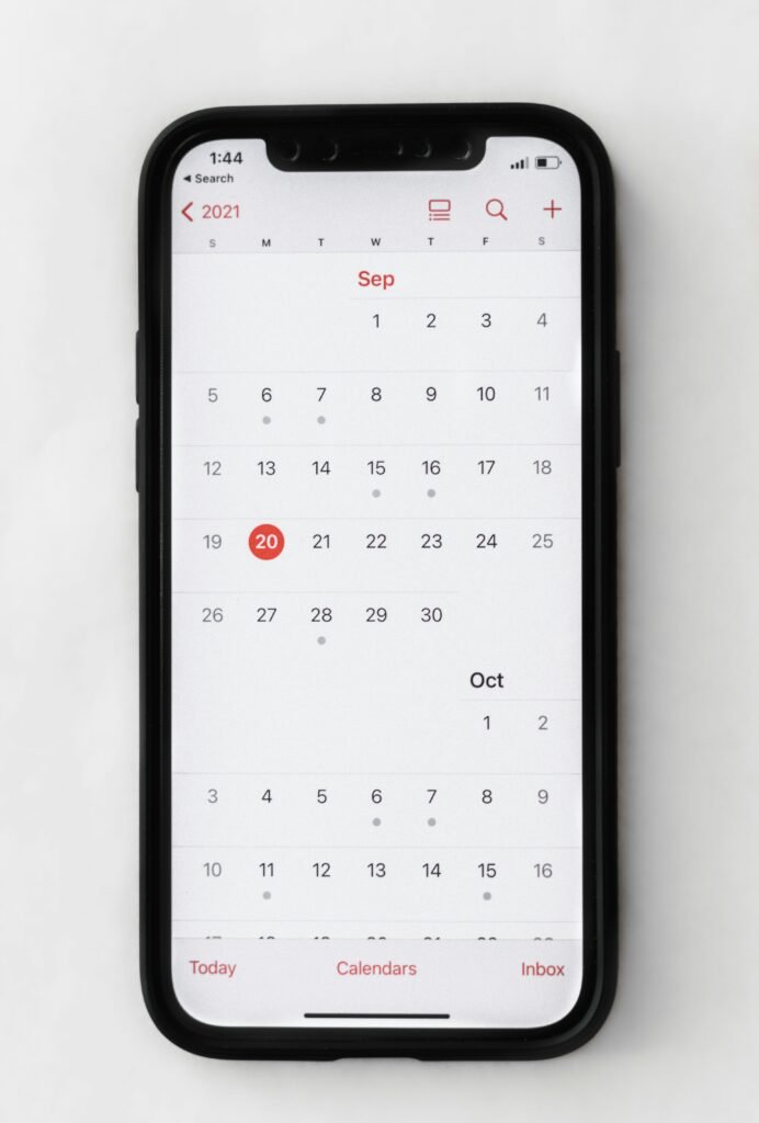 Smartphone showing a monthly calendar app used for ADHD time management and planning