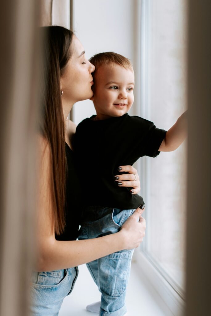 Mother kissing her son