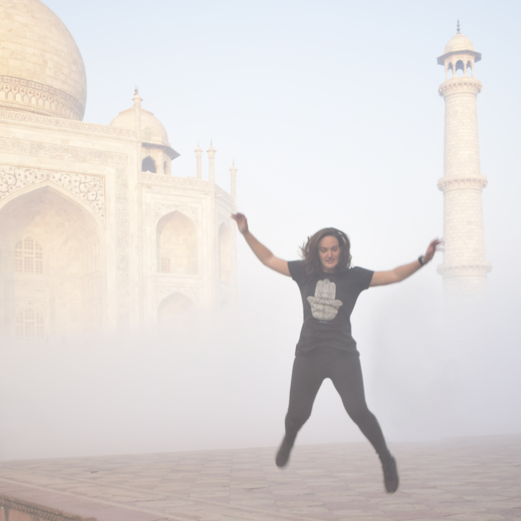 Tali Rosen jumping for joy in front of the Taj Mahal in India